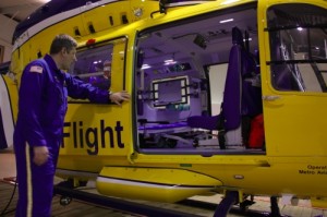 A Life Flight pilot inspects his aircraft during a lull.