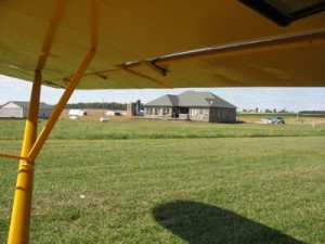 A new home, seen from the cockpit of Mark Scheibe's PA-11 Cub Special that just landed at Mohican Airpark.