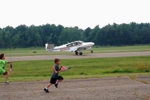 The Bonanza touches down on Portage County Airport's runway 27 as Ron Siwik arrives home.